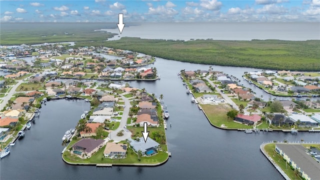 drone / aerial view featuring a residential view and a water view