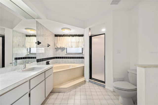 full bathroom with plus walk in shower, vanity, toilet, and tile patterned flooring