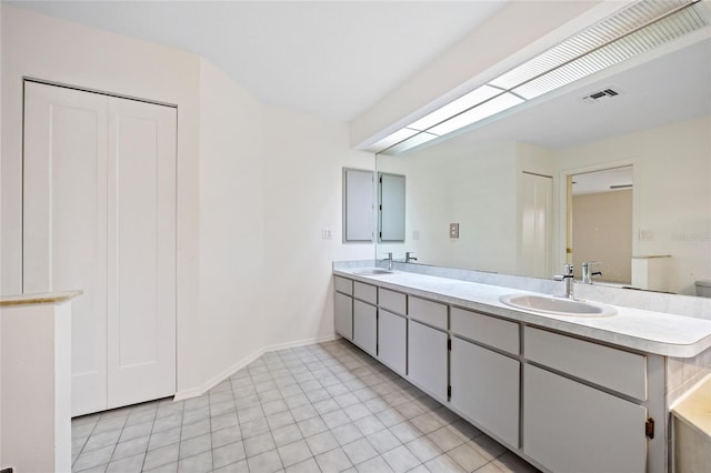 bathroom featuring tile patterned floors and vanity