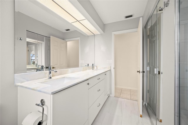 bathroom featuring vanity and tile patterned flooring