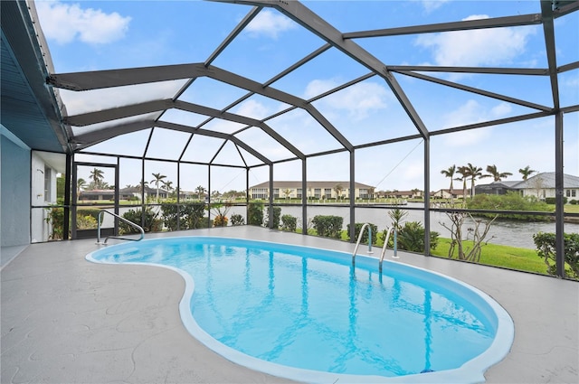 view of pool with a lanai, a water view, and a patio