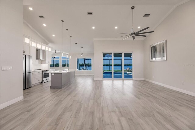 17183 Ohara Dr, Port Charlotte, FL 33948 - unfurnished living room featuring a ceiling fan, a sink, baseboards, high vaulted ceiling, and ornamental molding