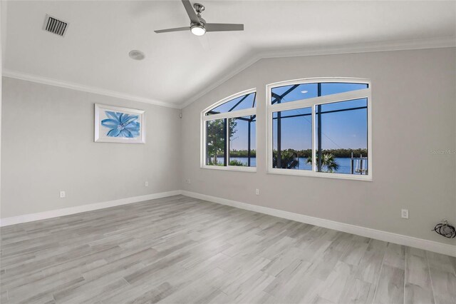 17183 Ohara Dr, Port Charlotte, FL 33948 - unfurnished room featuring vaulted ceiling, a ceiling fan, light wood-style flooring, crown molding, and baseboards