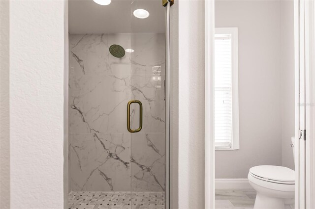 17183 Ohara Dr, Port Charlotte, FL 33948 - bathroom with a marble finish shower, toilet, marble look tile flooring, baseboards, and healthy amount of natural light