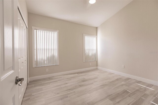 17183 Ohara Dr, Port Charlotte, FL 33948 - unfurnished bedroom featuring a closet, light wood finished floors, and baseboards