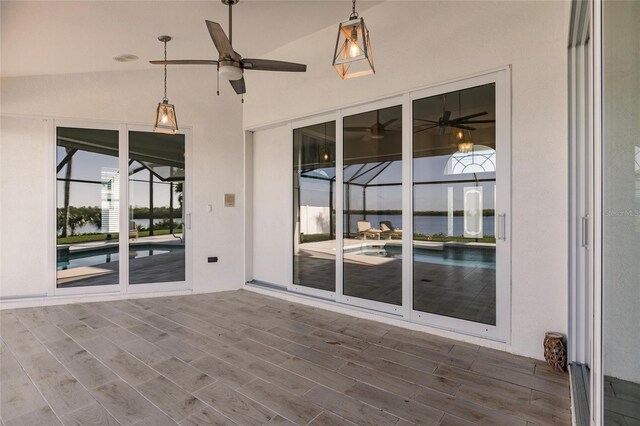 17183 Ohara Dr, Port Charlotte, FL 33948 - unfurnished sunroom with a ceiling fan and lofted ceiling