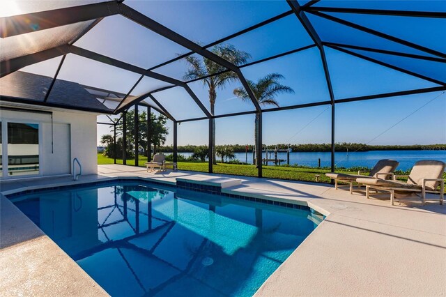 17183 Ohara Dr, Port Charlotte, FL 33948 - swimming pool featuring a patio area, a water view, and glass enclosure