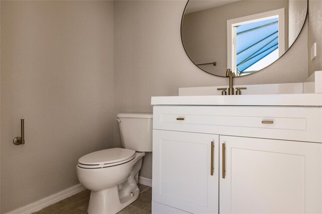 17183 Ohara Dr, Port Charlotte, FL 33948 - bathroom with baseboards, toilet, and vanity
