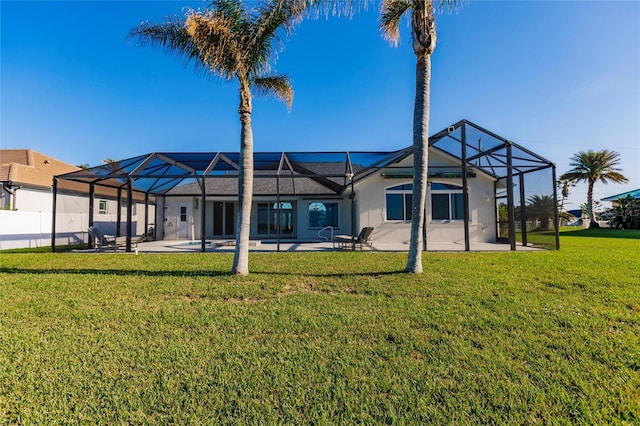 17183 Ohara Dr, Port Charlotte, FL 33948 - rear view of house with a patio, glass enclosure, and stucco siding