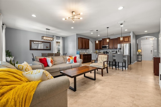 living room featuring a notable chandelier