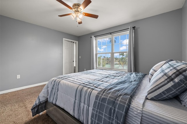 carpeted bedroom with ceiling fan