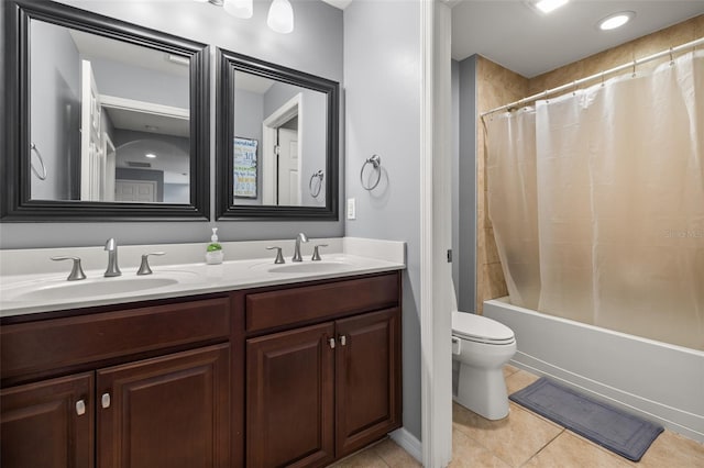 full bathroom featuring shower / tub combo with curtain, vanity, toilet, and tile patterned flooring