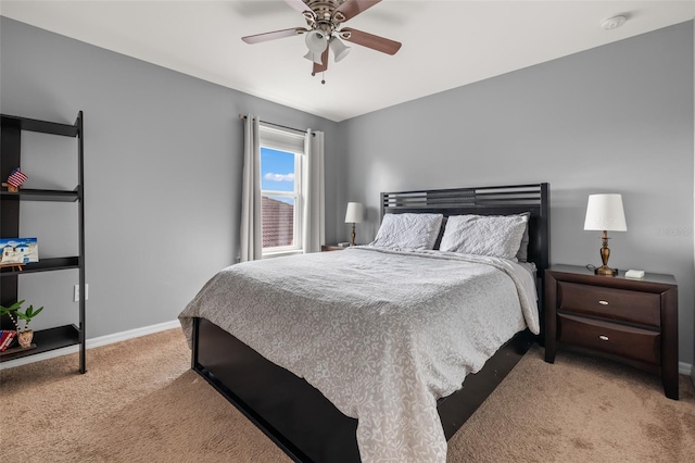 bedroom featuring ceiling fan and light carpet