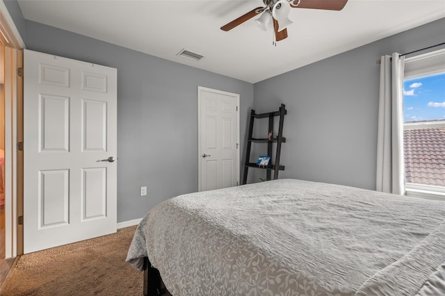 bedroom featuring ceiling fan and carpet