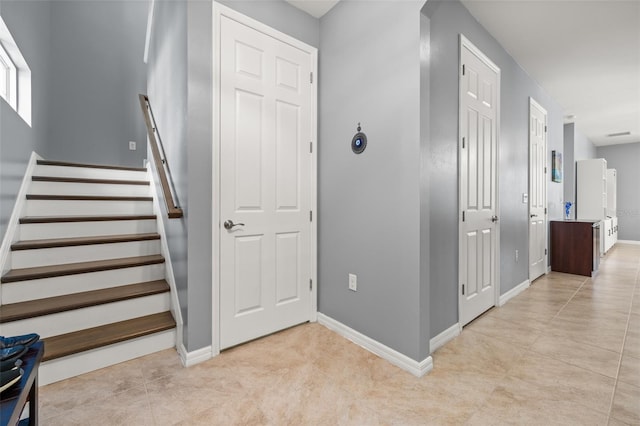 stairs with tile patterned flooring