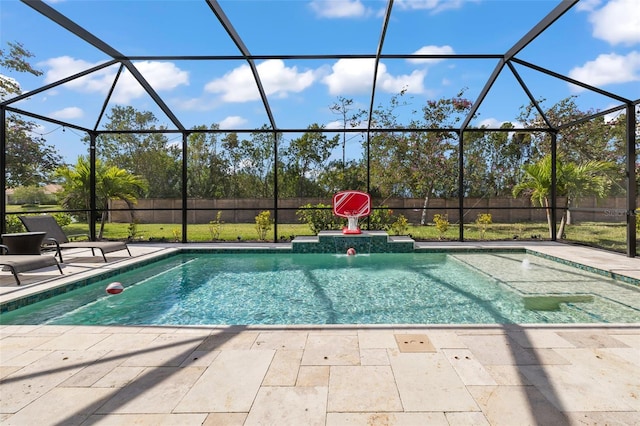 view of swimming pool with a patio, a lanai, and pool water feature