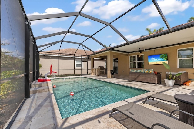 view of pool featuring an outdoor hangout area, a lanai, a patio area, and ceiling fan