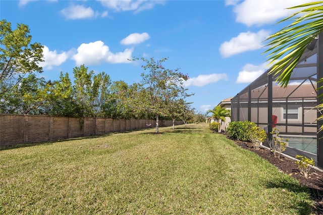 view of yard featuring a lanai