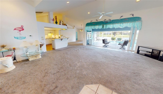 living room with ceiling fan, light carpet, and high vaulted ceiling