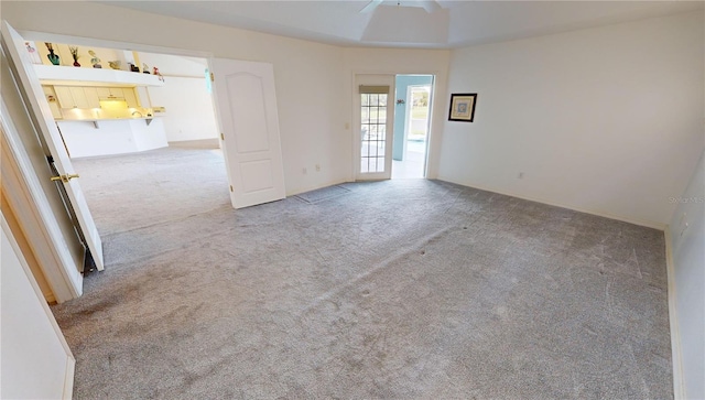 carpeted empty room with ceiling fan