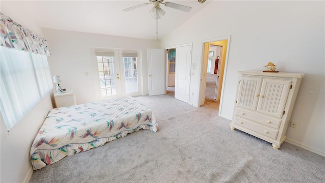 bedroom with ceiling fan, light colored carpet, access to outside, and vaulted ceiling