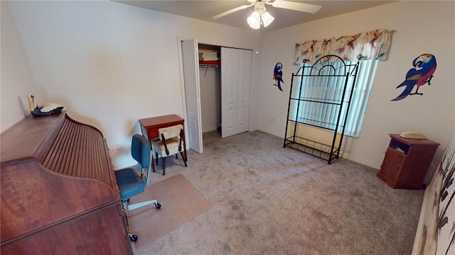 office space with light carpet and ceiling fan