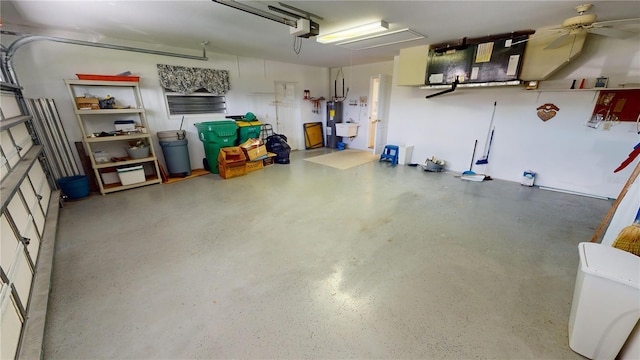 garage with ceiling fan and a garage door opener