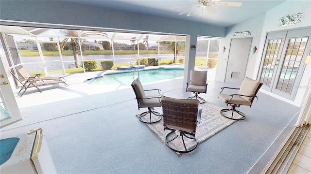 exterior space featuring a pool, vaulted ceiling, and ceiling fan