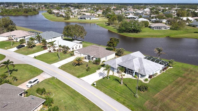 birds eye view of property with a water view