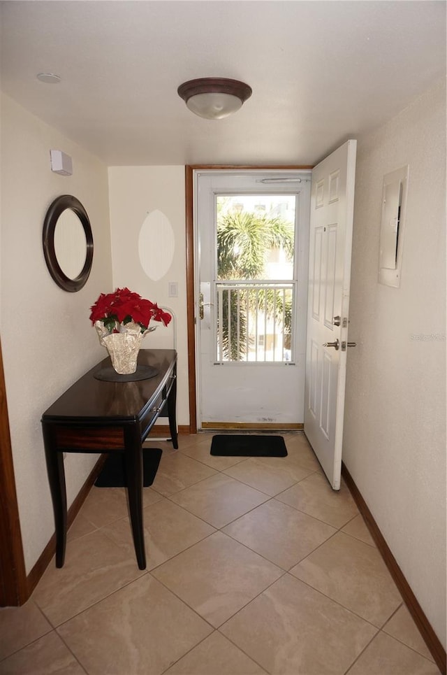 entryway featuring light tile patterned floors and electric panel