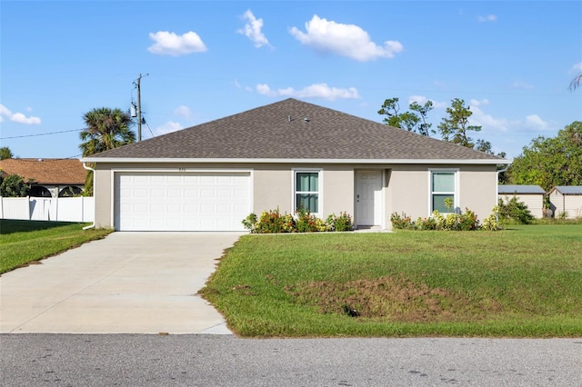 single story home featuring a garage and a front lawn