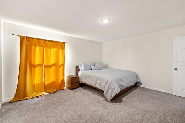 bedroom with light colored carpet