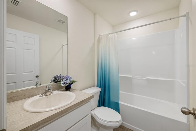 full bathroom with shower / tub combo, vanity, and toilet