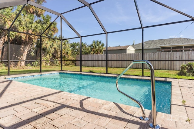 view of pool with a patio and a lanai