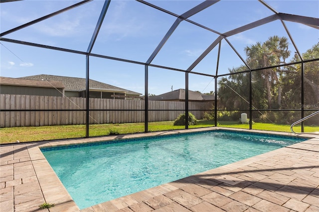 view of swimming pool with a lanai and a patio area