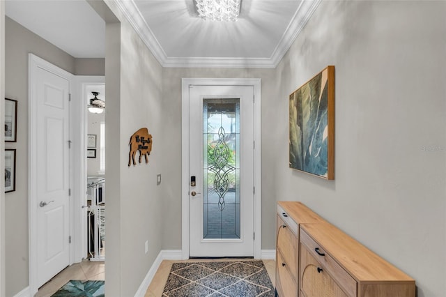 tiled foyer featuring ceiling fan with notable chandelier and ornamental molding