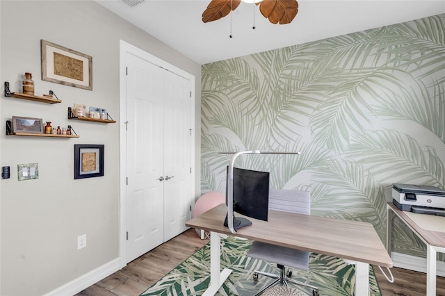 office area with hardwood / wood-style floors and ceiling fan