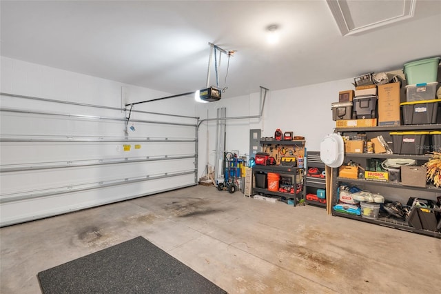 garage featuring electric panel and a garage door opener