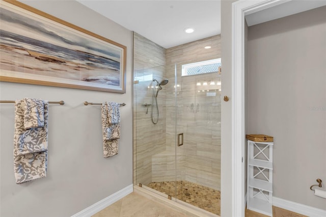 bathroom featuring tile patterned flooring and a shower with shower door