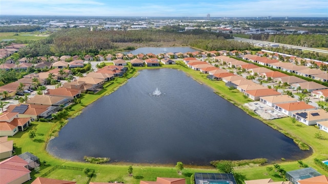 drone / aerial view with a water view and a residential view