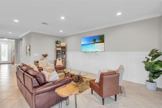 living area with light tile patterned floors, recessed lighting, a decorative wall, visible vents, and ornamental molding