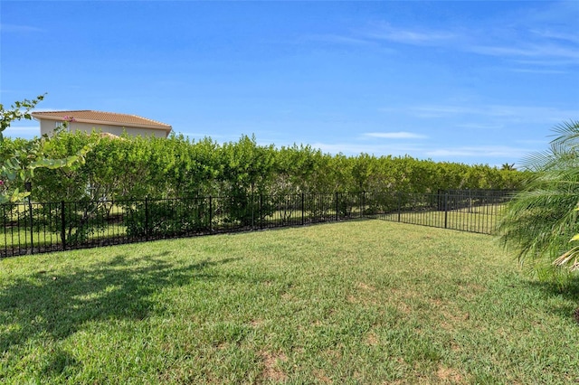 view of yard with a fenced backyard