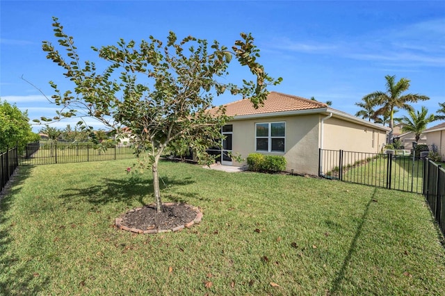 view of yard with a fenced backyard