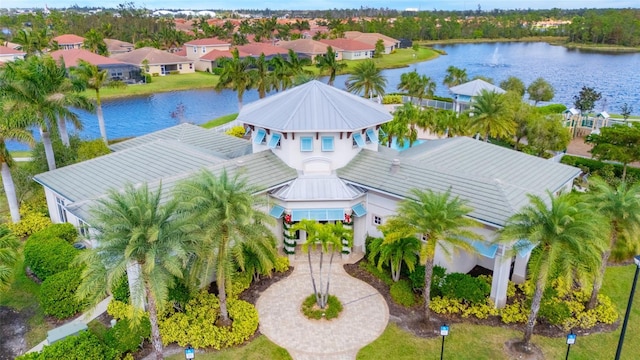 drone / aerial view with a residential view and a water view