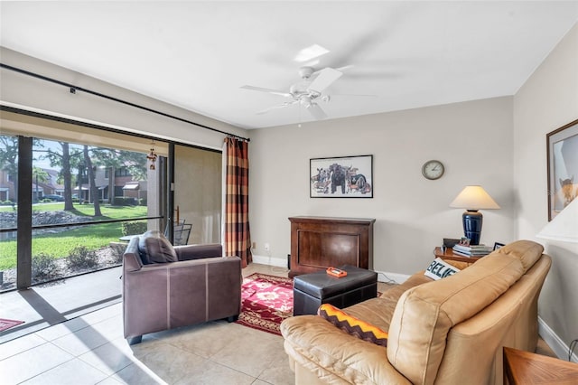 living room featuring light tile patterned floors and ceiling fan