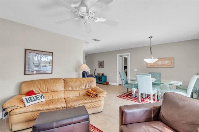 tiled living room featuring ceiling fan