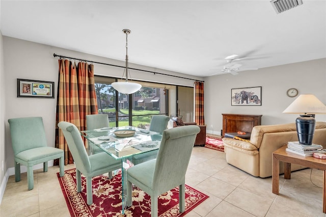 dining area with light tile patterned floors and ceiling fan