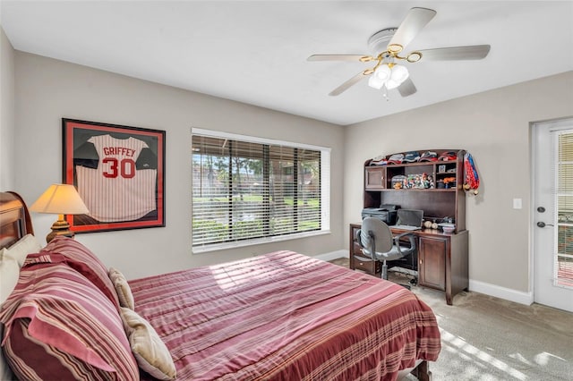 carpeted bedroom featuring access to exterior and ceiling fan