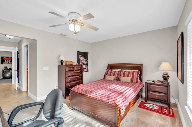 bedroom featuring light tile patterned floors and ceiling fan