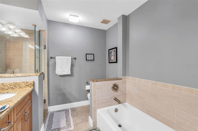 full bathroom with toilet, vanity, tile patterned floors, and independent shower and bath